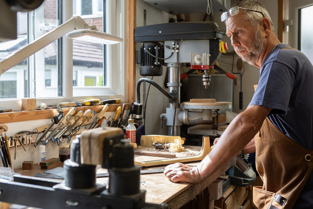 Handcrafted acoustic guitar being worked on in the Arden Guitars workshop